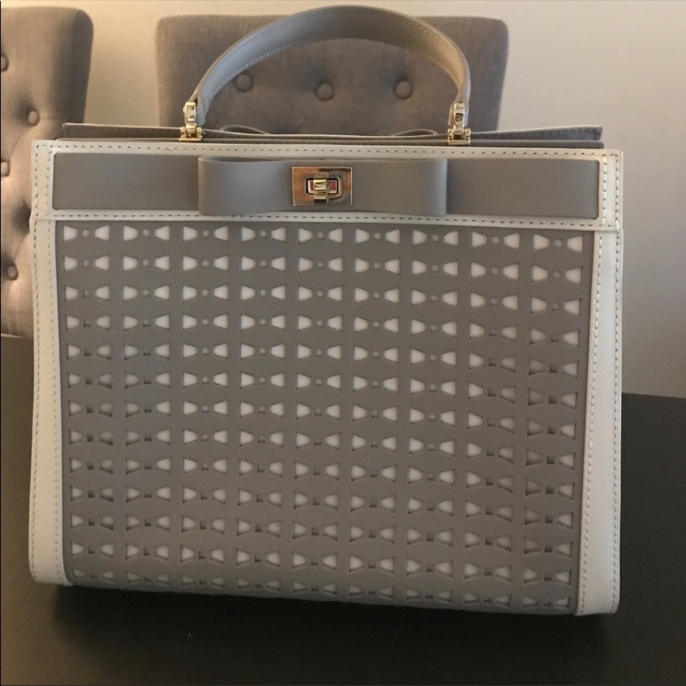 Light gray Kate Spade bow top handle satchel